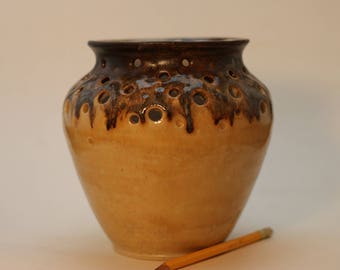 Copper over yellow ceramic vase.