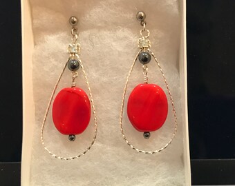Dangling red earrings