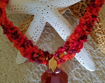 Handknit ribbon yarn necklace with 28mm Swarovski crystal sea shell focal bead, Swarovski crystal accents