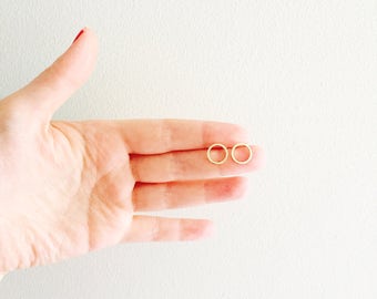 Brushed gold circle minimalist stud post earrings.