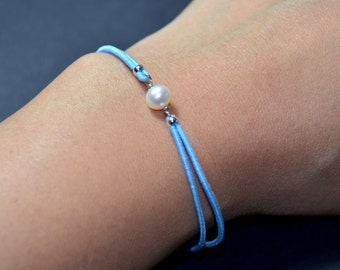 Bracelet freshwater pearl blue cord