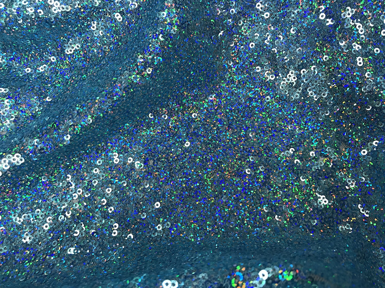 Iridescent Light Blue Mini Disk Sequins On Mesh Fabric By The