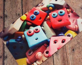 Happy Robot Faces Pile Up Art Postcard
