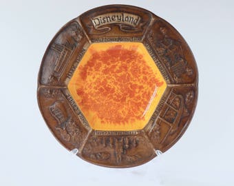 Vintage 1970's bronze and orange Disneyland souvenir plate. Disney plate, trinket dish. Mark twain. Jungle cruise. Haunted mansion. Castle.