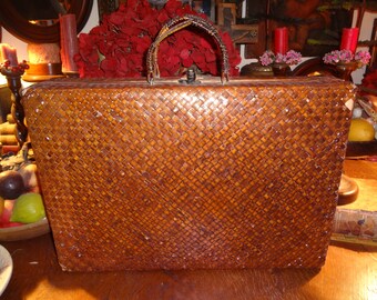 Love this woven rattan tote lined with blue and white striped floral cotton material