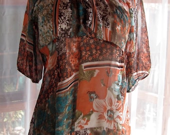 Sheer orange and turquoise blouse with front smocks