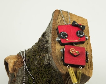 Red robot pendant with heart