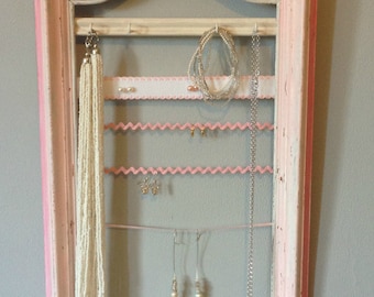 Jewelry patinated frame, lace and rickrack on display