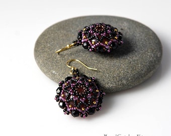 Beadwoven mandala earrings in black and purple