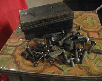 mens antique junk ina small metal trunk like box