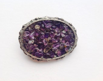 Amethyst brooch on white metal