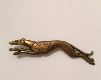 Vintage 1970 copper greyhound pin.