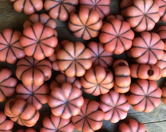 12 plastic flat pumpkin shape beads orange