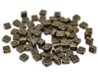 20 small spacers with decor, 5 mm bronze