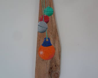 Fishing buoys painted on Driftwood