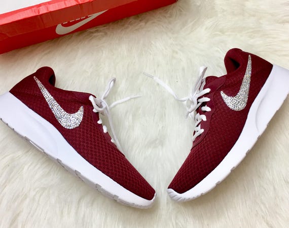 burgundy nike sandals with gold check