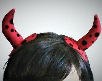horn hair clips , red with with black dots
