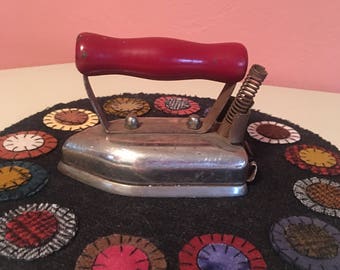 Vintage Toy Iron with Red Handle.