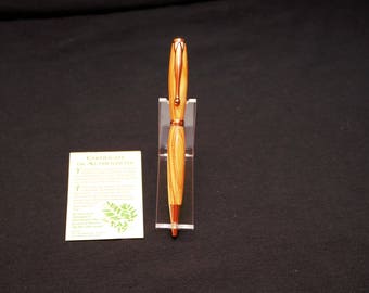 Olive wood from the Holy Land. This is a wood turned hand crafted Gold pen, so beautiful!!!