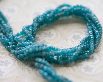 Fabulous Light Blue Apatite Faceted Rondelles Beads 3mm- 3.5mm 6 1/2 inch strand (10)