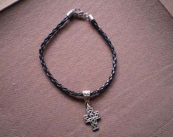Black leather bracelet woven with silver cross charm