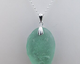 Turquoise Sea Glass Nugget found on an Orkney Beach mounted as a pendant on a good quality 18 inch sterling silver chain.