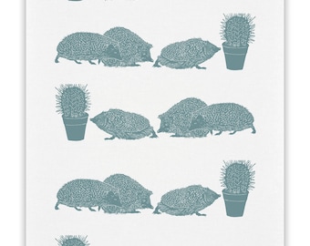 100% cotton tea towel with Hedgehogs looking at a cactus