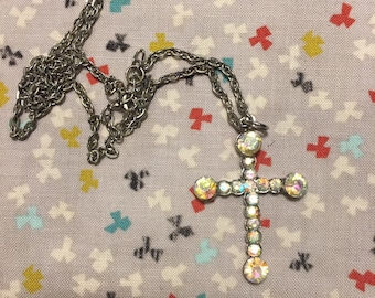 Iridescent silver tone cross necklace
