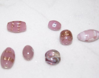 7 gold and pink tone glass beads