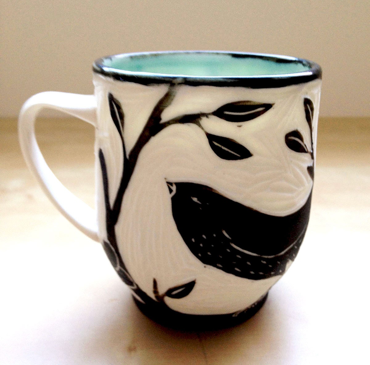 Porcelain Hand Carved Cup with Black Bird