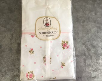 Pair of vintage printed cross stitch pattern pink floral pillowcases, still in package, never used