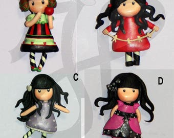 Refrigerator magnets with little dolls