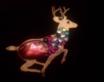 Cute leaping Reindeer brooch. Handcrafted from wood ready for Christmas.