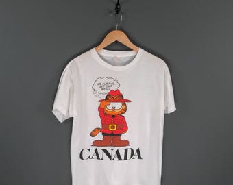80s Canada Mountie RCMP Garfield T-Shirt. Vintage 1980s Garfield Royal Canadian Mounted Police We Always Get Our Meal Souvenir Tee.