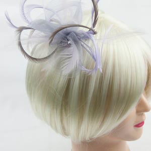 Silver grey fascinator with accent colour of lilac. On a clip, comb or Alice band