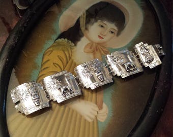 sterling silver artist made story teller wide link bracelet