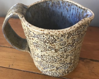 Handmade pottery creamer pitcher w/ fish pattern