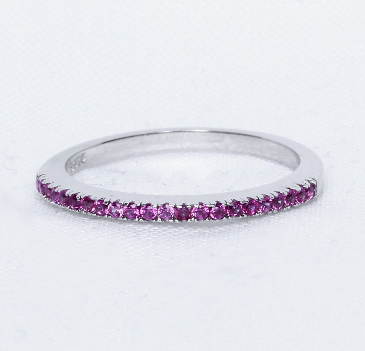 1.2mm wide Pink Sapphire Half Eternity ring in white gold or