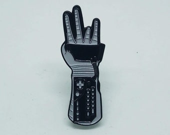 3 up Powerglove enamel pin