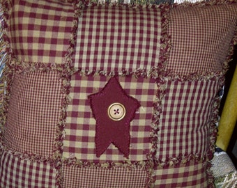 burgundy primitive rag pillow with star and wooden button