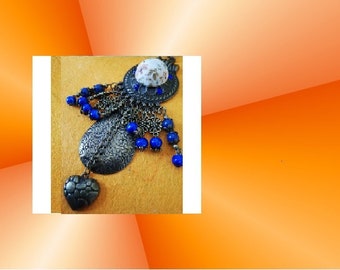 Great ethical bronze pendant and its lovely blue glass beads