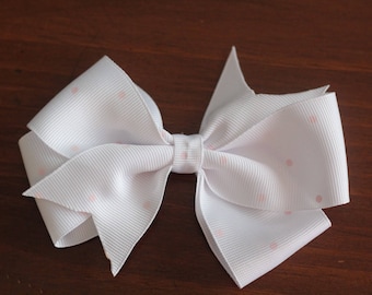 White and pink dot bow clip