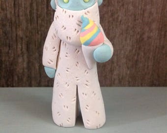 Yeti with rainbow snow cone figurine/ornament