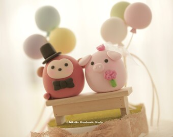 pig and monkey wedding cake topper