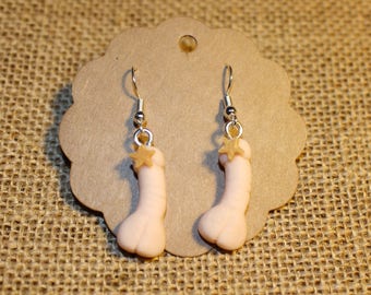 Censured white penis earrings