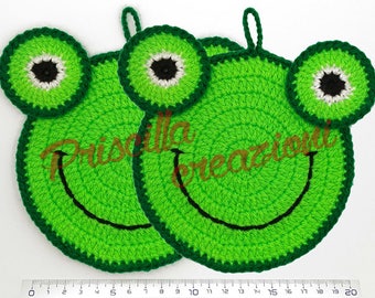 Pair of handmade pot holders made from crochet in the shape of a frog