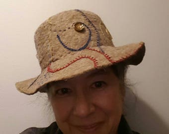 Wide brimmed button hat with stitching embellishment