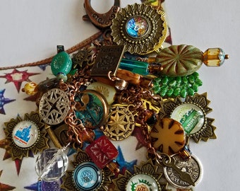 Charm Fob Clip-on inspired by Disney Dooney "PASSPORT" Handbags. Featuring unique charms & beads that will remind you of all four WDW parks!