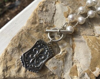 Sterling Fleur de Lis Necklace. Fleur de Lis Charm Necklace on Freshwater Pearls.