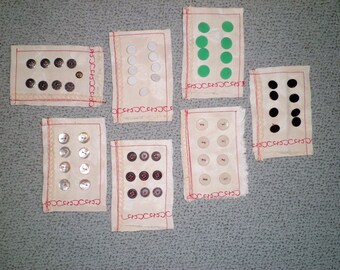 59 vintage buttons, on antique lines